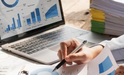 person creating reports on laptop