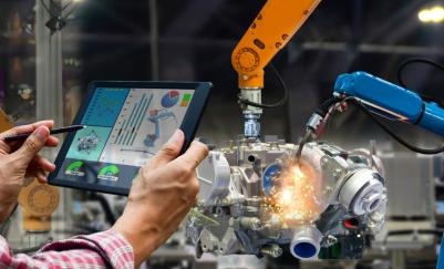mechanical engineer controlling robotic systems with tablet