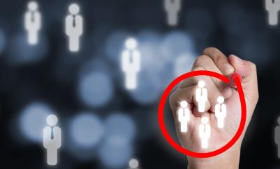 A hand circling a group of job candidates with a red pen