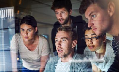 Group of people looking at a computer screen