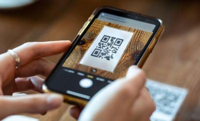 person scanning a qr code with phone